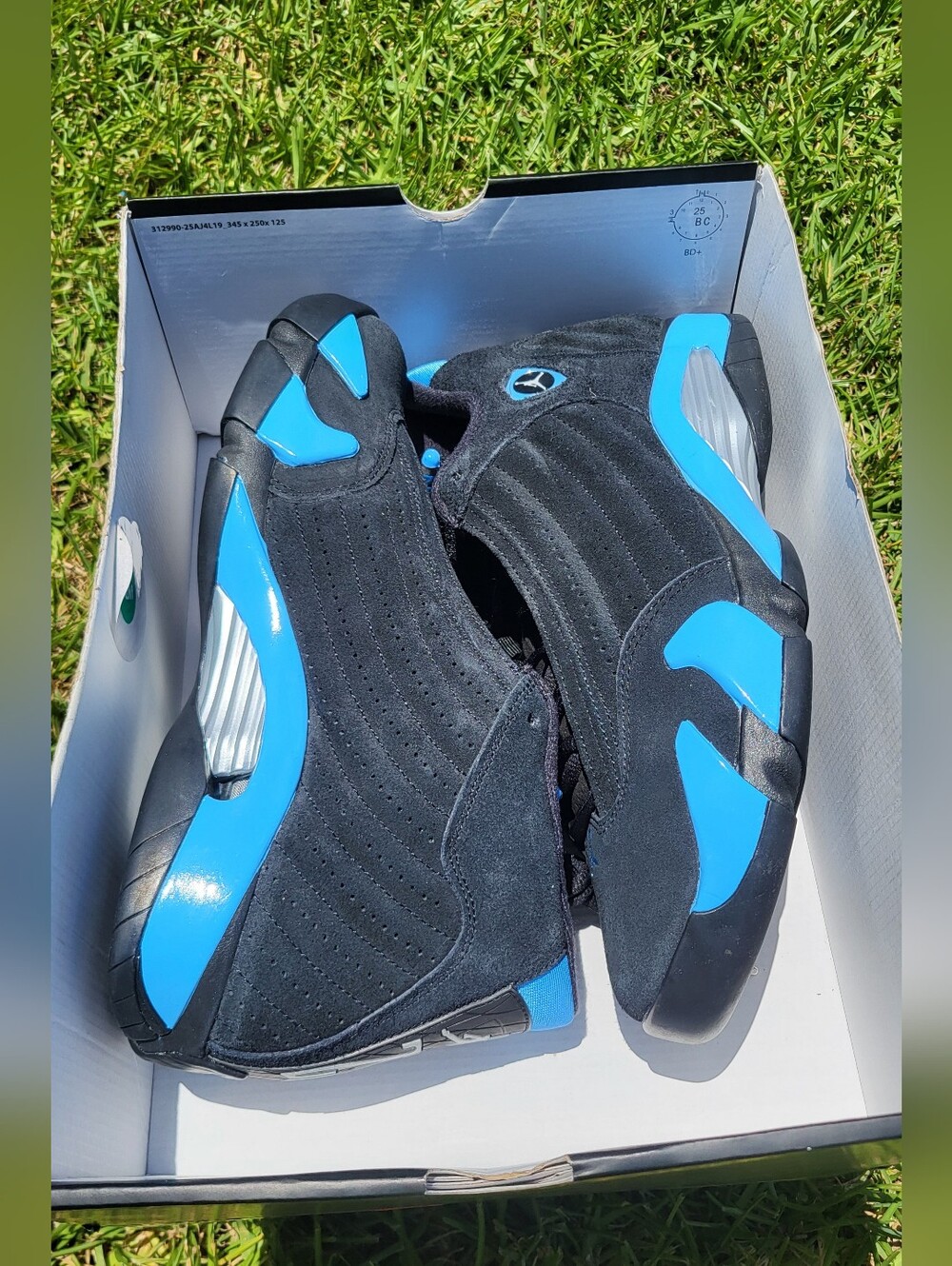 Air Jordan 14 Retro Black and University Blue Sneakers
